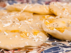 Cypriot style pasta, Pirohu, filled with dry, mature Anari cheese, sauteed in olive oil & sprinkled with cheese